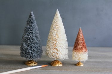 whimsically painted trees made from bottle brushes