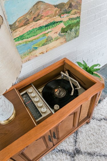 Painting over wood sideboard on beige rug