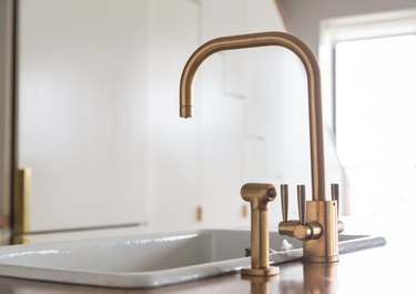 A brass sink faucet