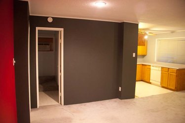 Dark grey walls with light grey carpet