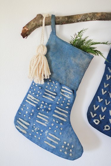 Indigo stocking with decorative branch