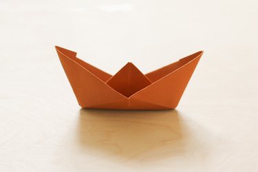 Folded brown paper boat