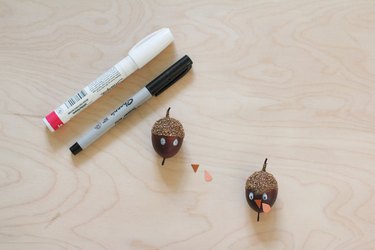 Acorns made into turkeys for decorations with pens