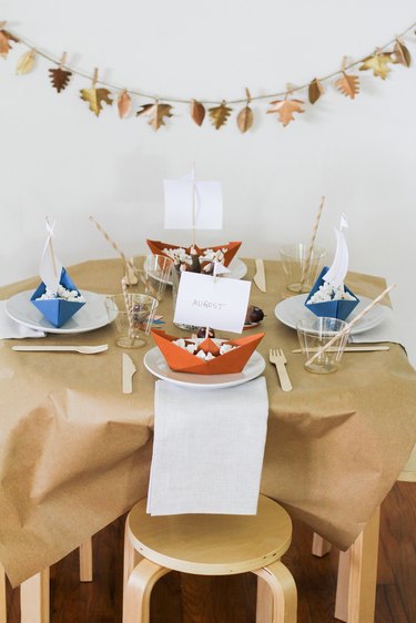 Kids dining table with Thanksgiving decorations and disposable dishware