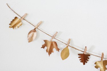 Thanksgiving garland with wood clothespins and paper leaves