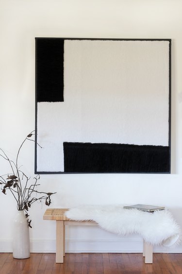 oversized diy shearling wall art above bench