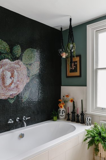 tiled floral wall mural with green walls in bathroom