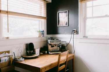 espresso machine sitting on top of wood table