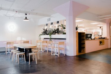 the interior of camellia coffee with white walls and lavender tile