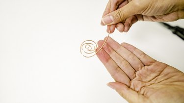 twisting copper wire into a spiral shape