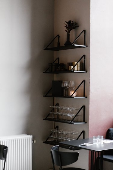 Shelving with glassware in Minimalist bar