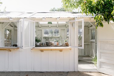 home exterior ideas with white plant shed