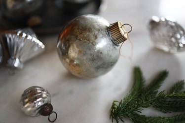 Metallic ornaments and pine branches
