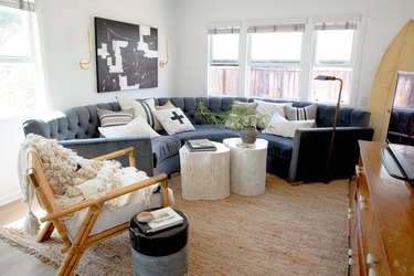 living room with charcoal gray sofa and natural accents
