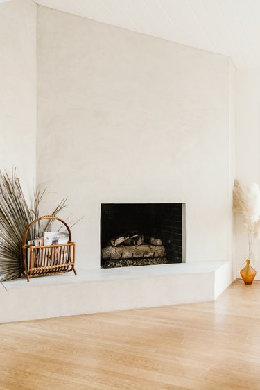 Large white wall fireplace with boho decor