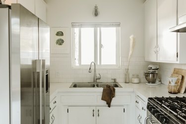 White galley kitchen with window over sink