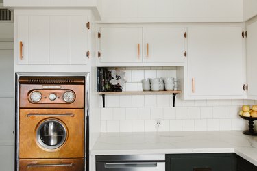 White kitchen with midcentury copper oven