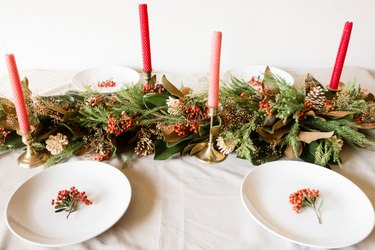 Holiday table with live winter table runner and centerpiece