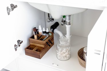 Makeup Organizer Ideas with Wood makeup organizer, glass canister, under the sink.