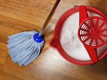 mop and bucket with water for cleaning floors
