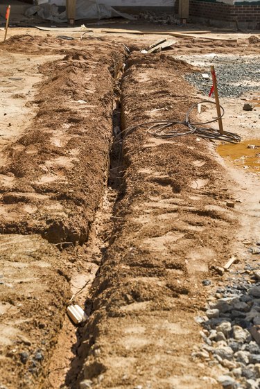 Buried cables in utility trench on construction site