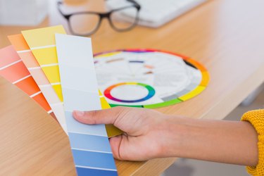 Hand holding colour swatches