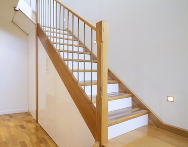 Oak and white stair case home interior