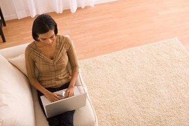 Woman relaxing with laptop