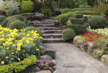 stone walkway in flower garden