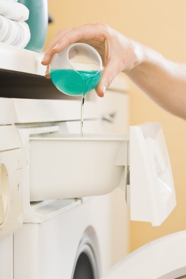 Hand pouring detergent
