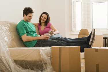 Couple relaxing in new home