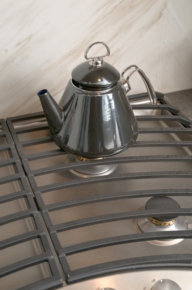 Tea kettle on contemporary gas stove