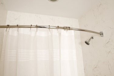 Double Your Shower's Storage Space With This Simple Curtain Rod Hack