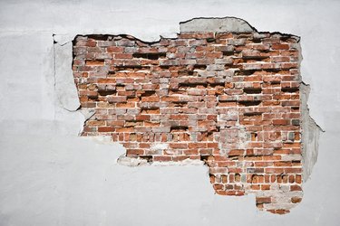 Brick behind wall
