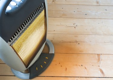 Halogen or electric heater on wooden floor