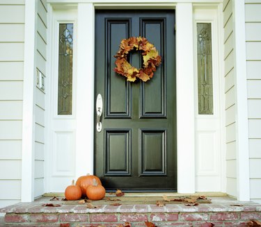 Pumpkins on front step of house