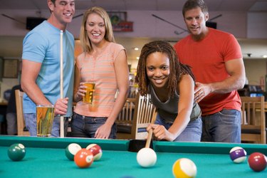 Friends playing pool