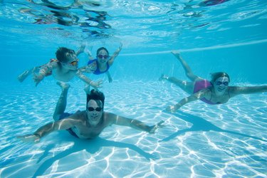 Family swimming underwater