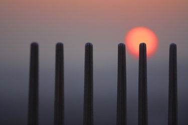 Sunset behind posts