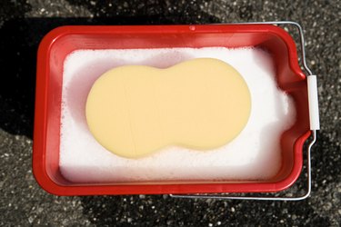 Sponge in bucket of soap