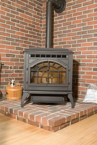 Wood stove in brick corner