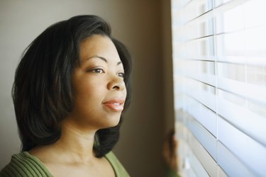 Woman looking out window