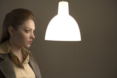 Woman looking at light fixture