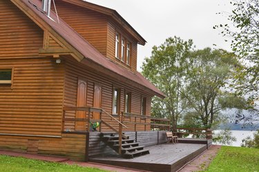 country wooden house close to lake