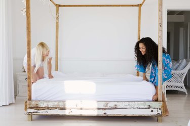 Women making bed