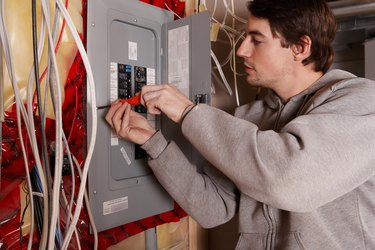 Man with electrical panel