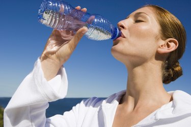 Woman drinking bottled water