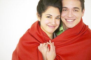 Couple wrapped in a blanket