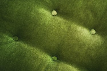 Detail of green velvet chair