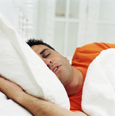 Man sleeping in bed, close-up